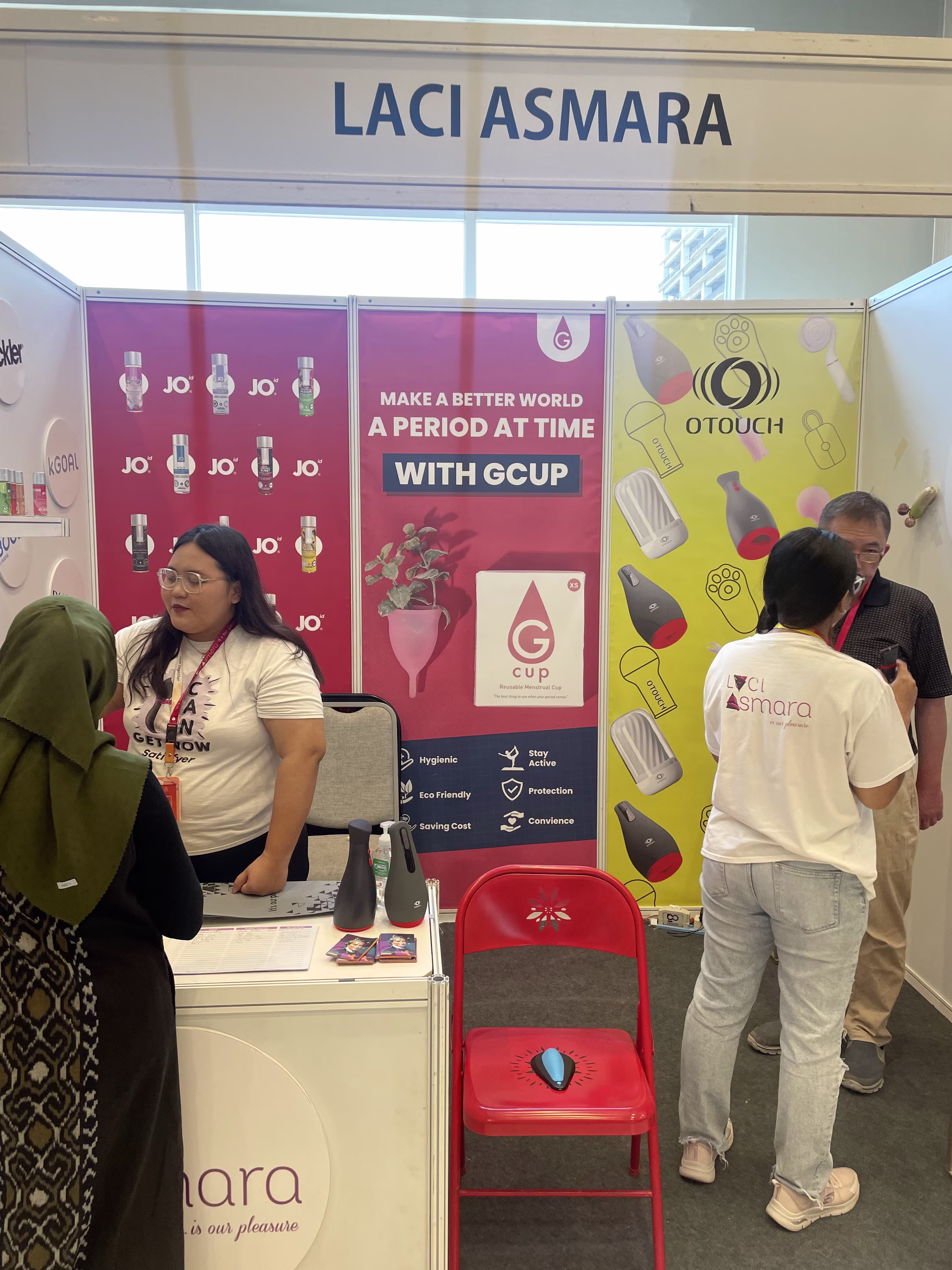 Visitors and staff discussing products at the busy Laciasmara booth during SIMNAS ASI 2023