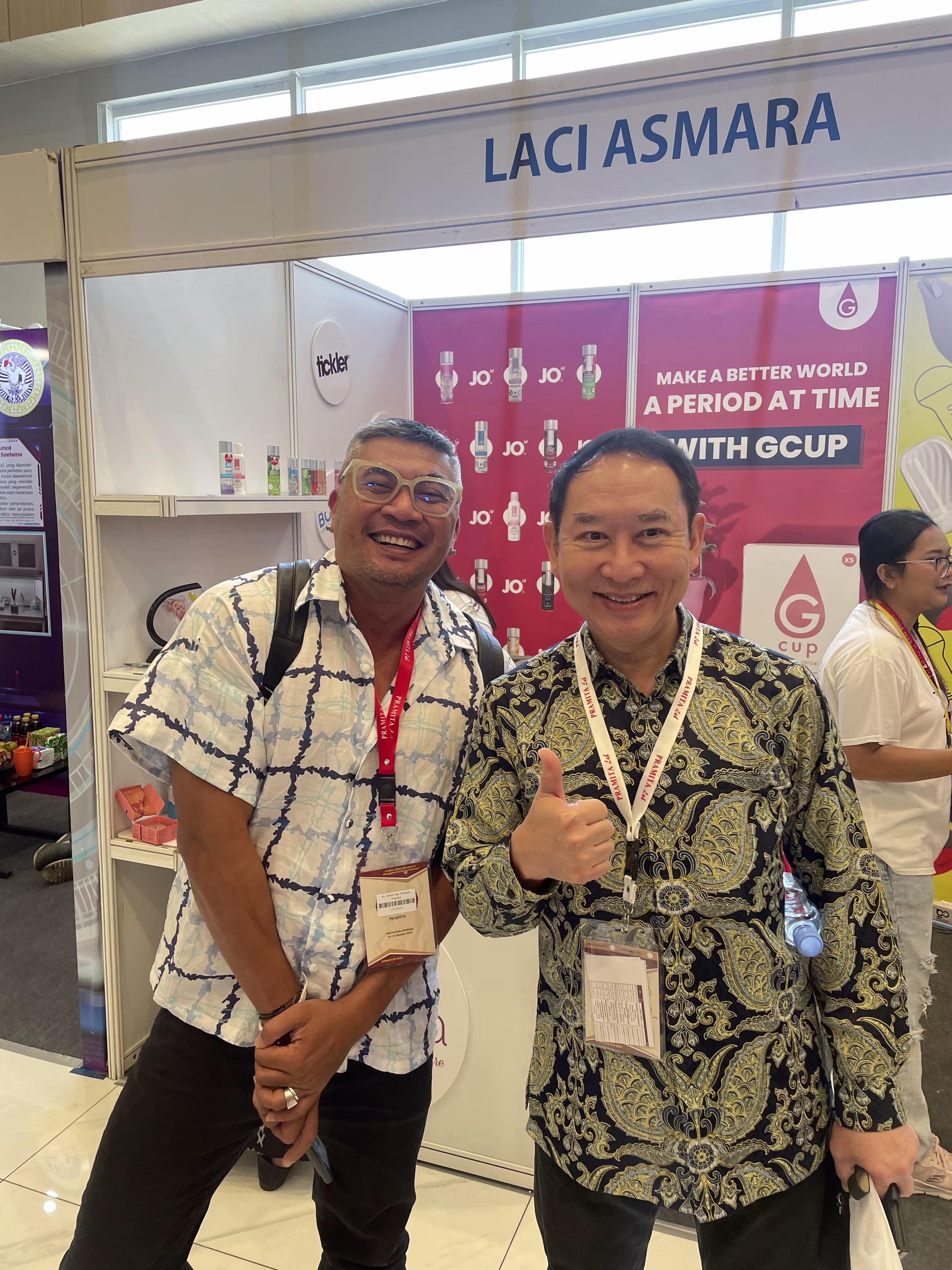 dr. Yogi from Bali Medika Klinik and dr. Heru Oentong, M.Repro, Sp.And(K) smiling in front of the Laciasmara booth during SIMNAS ASI 2023
