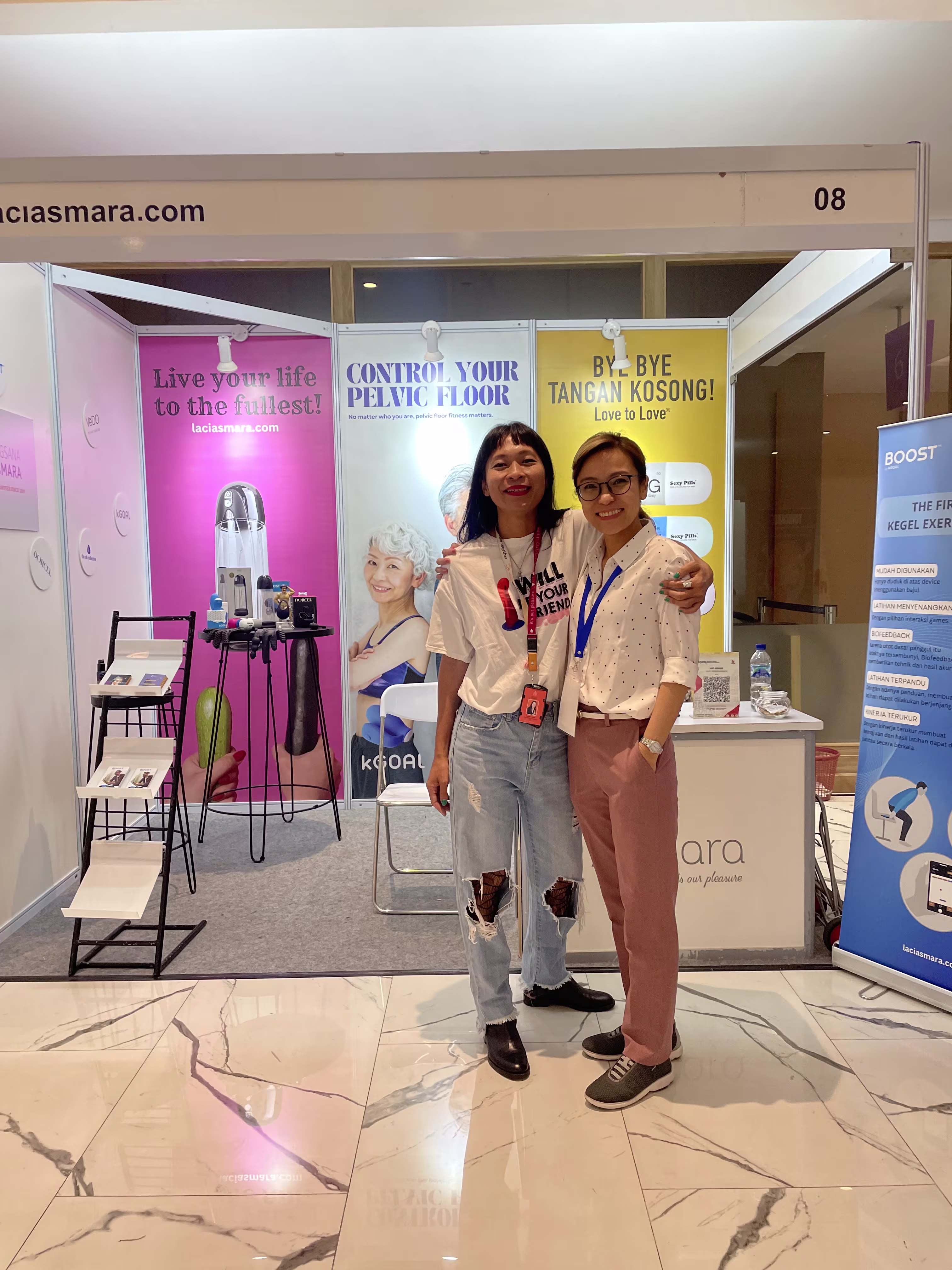 dr. Sandra Suryadana and Rendra Susanti standing in front of the Laciasmara booth at PIT PERSANDI XIV 2023