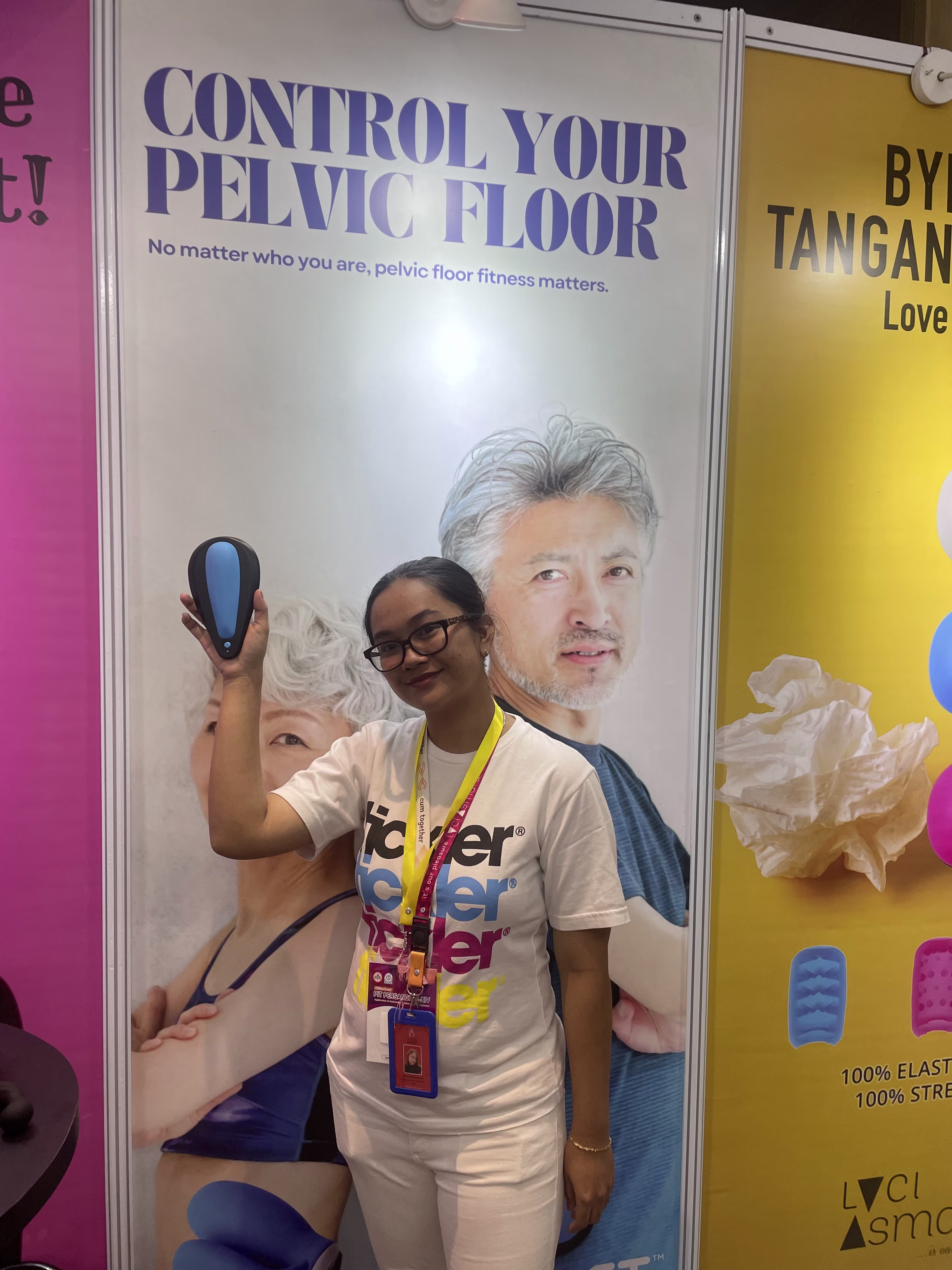 Laciasmara staff holding up and showing the kGoal Boost sit-on Kegel trainer for men and women