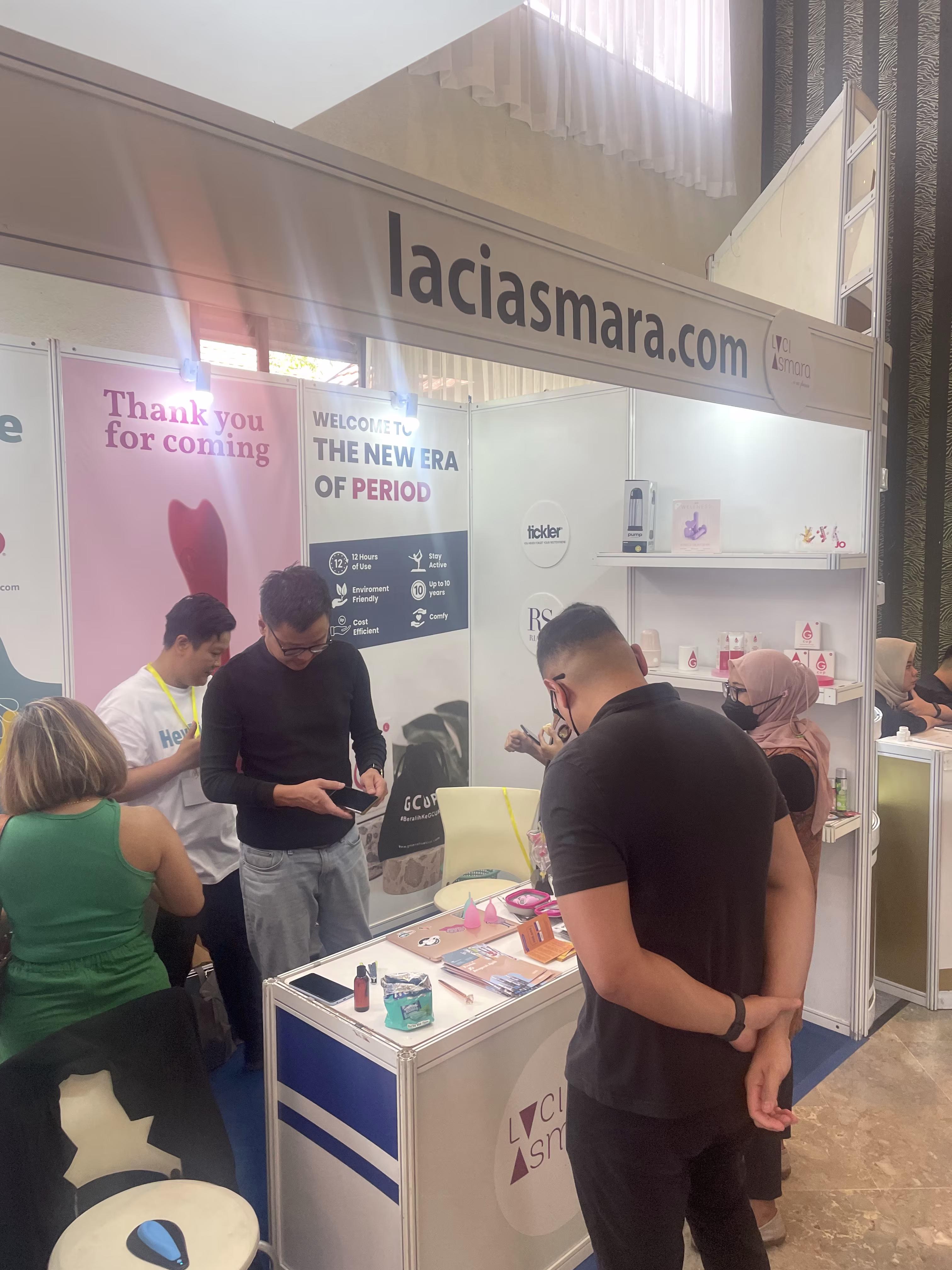 An attendee browsing products at the Laciasmara exhibition booth during NASWAAM 2023