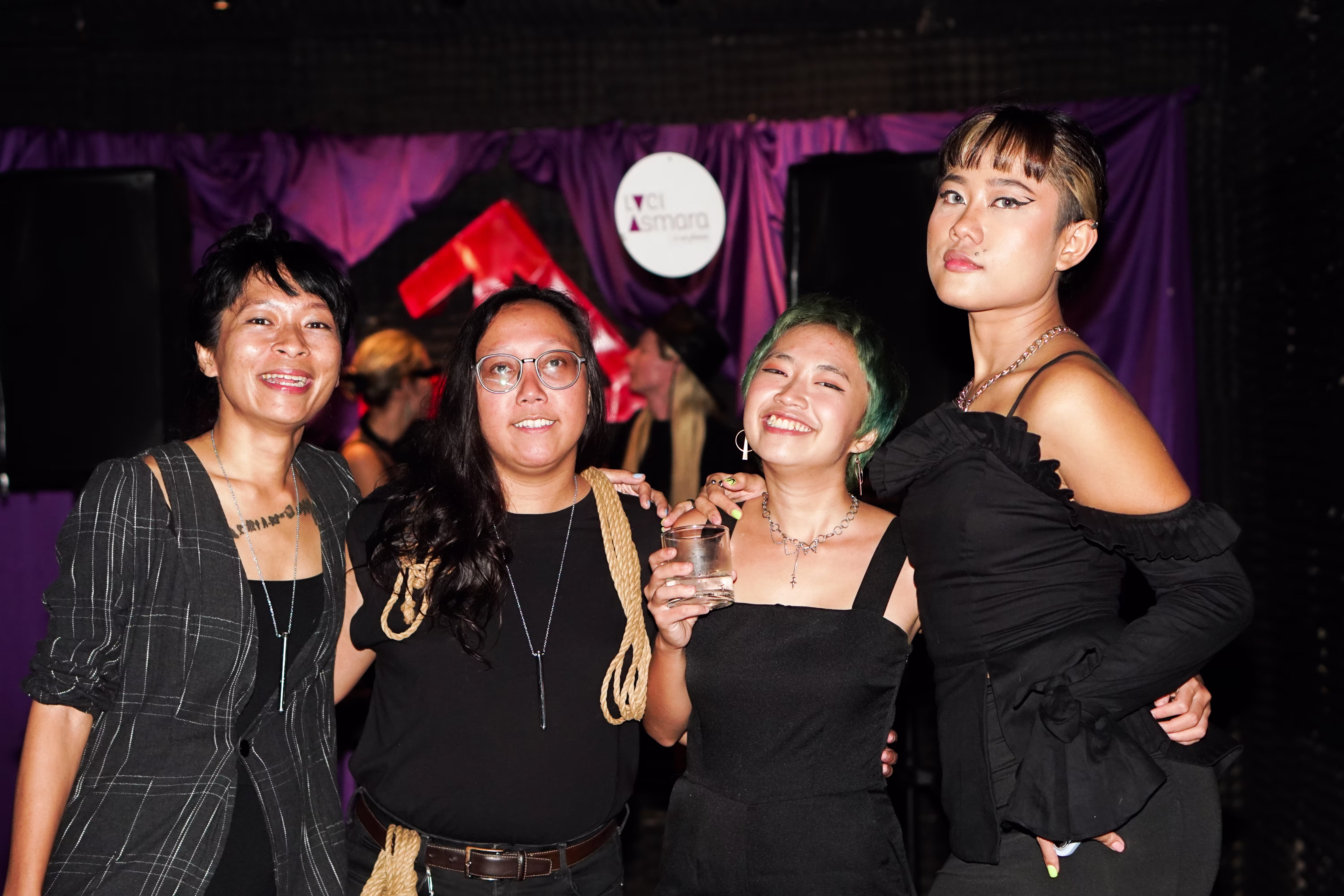 Laciasmara founder Rendra Susanti smiling alongside three Asmaradoor advocates at the Tingle and Mingle Party at Joshua District