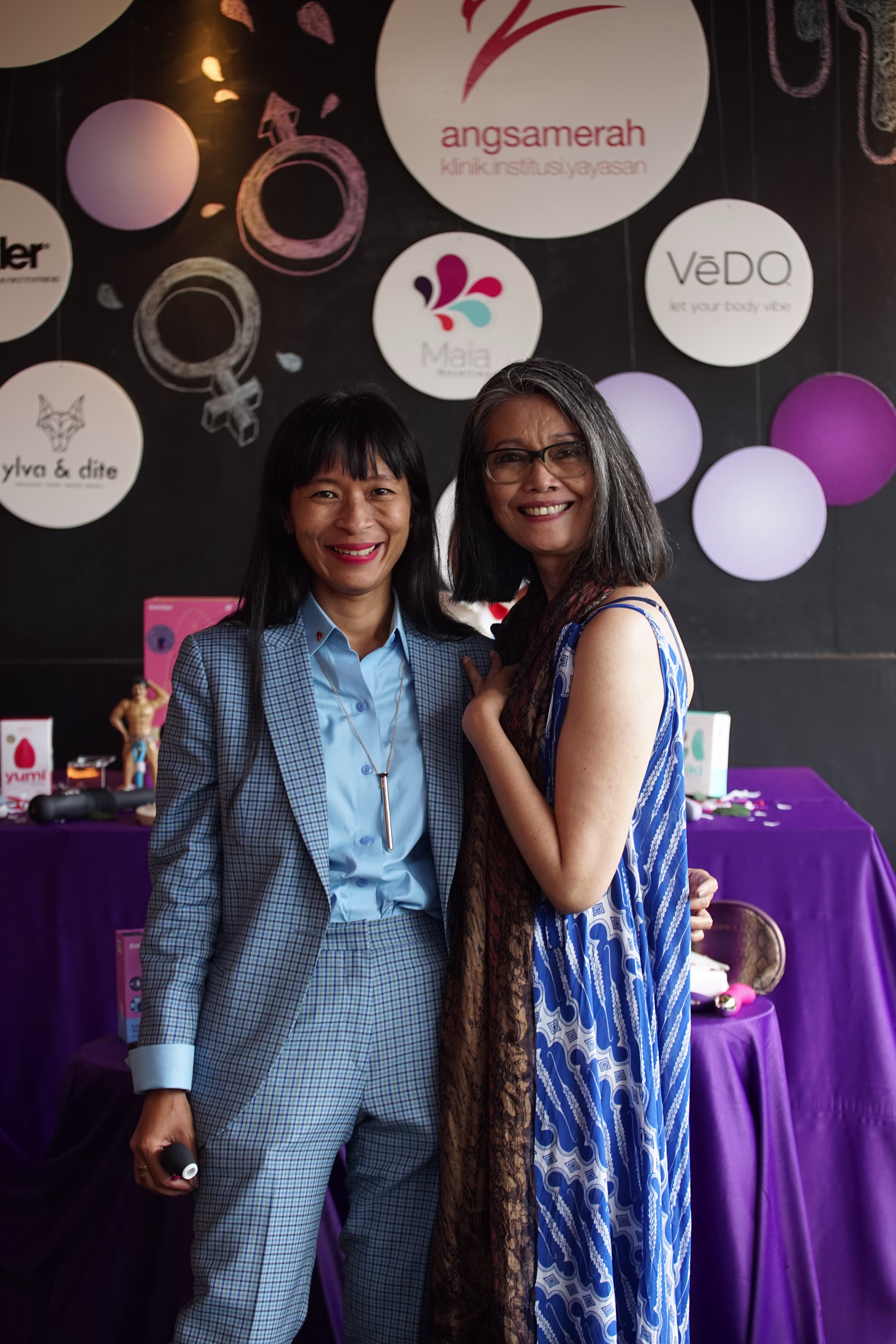 Laciasmara founder Rendra Susanti and a colleague standing proudly in front of the collaborative product showcase table