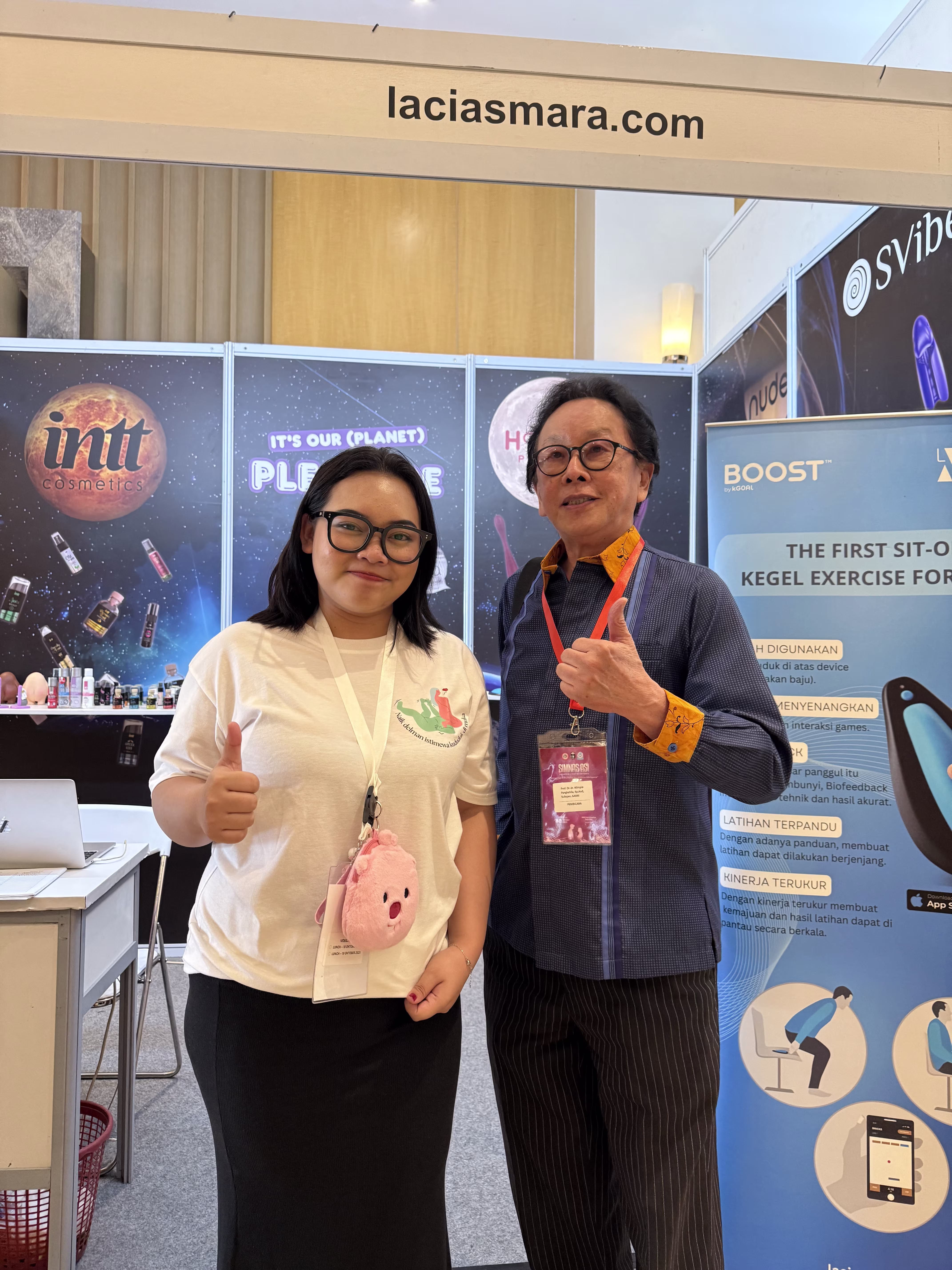 Prof. Dr. dr. Wimpie Ishak Pangkahila Sp.And (K) and Inez posing at Laciasmara Booth SIMNAS ASI 2025